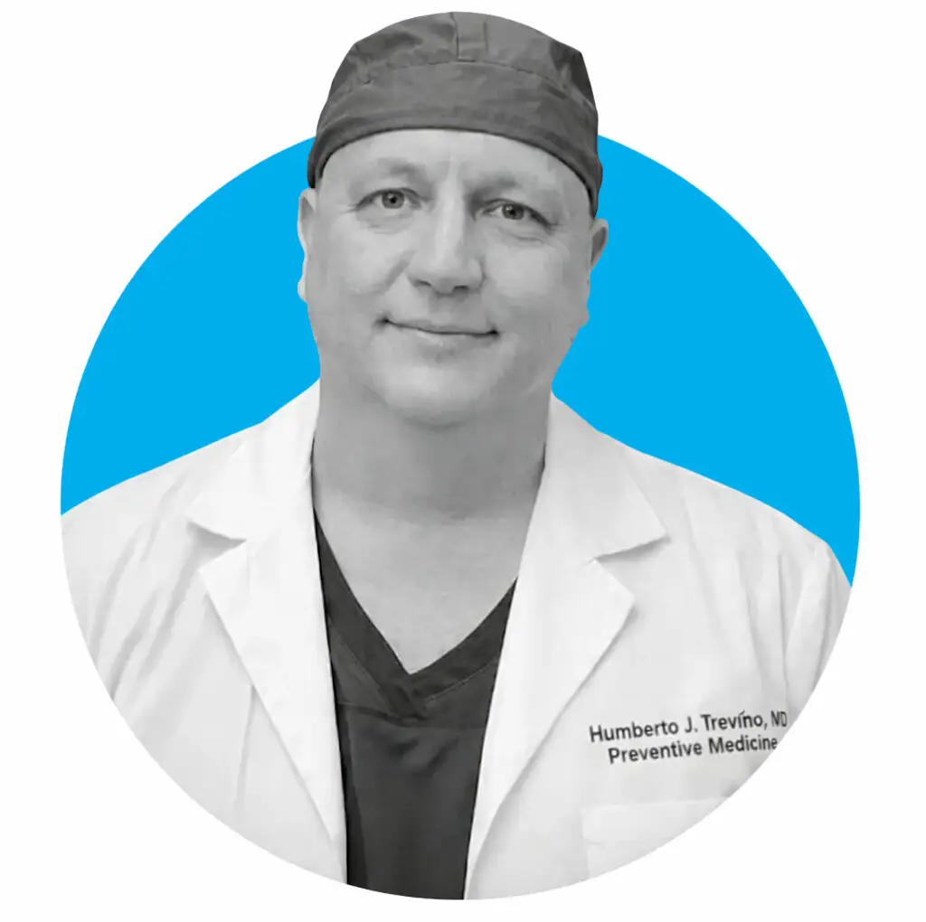 Doctor portrait in white coat and scrub cap